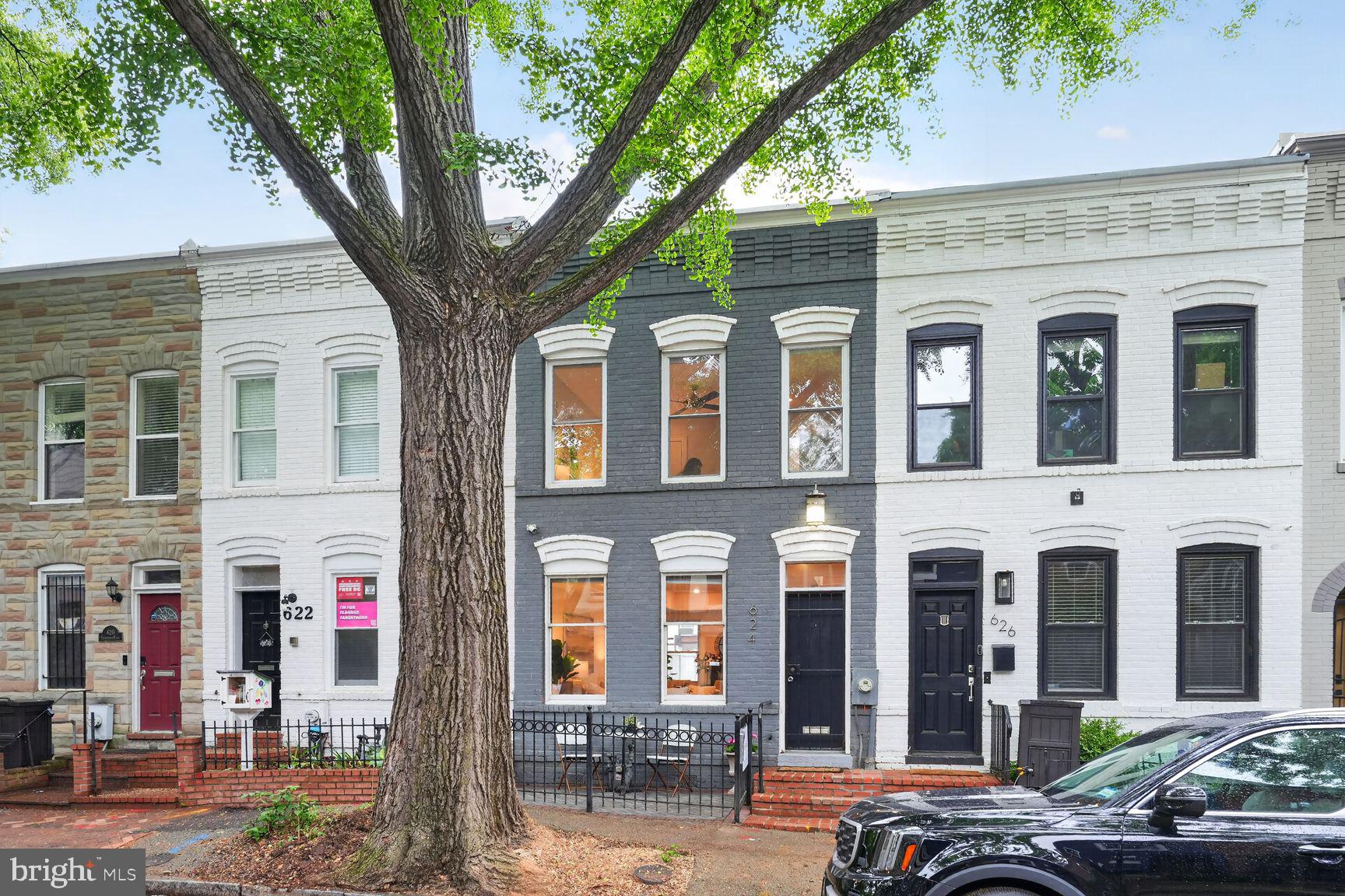 624 14th Place Northeast Washington, DC 20002 - Photo 25 of 25 a front view of a building with lots of windows and trees