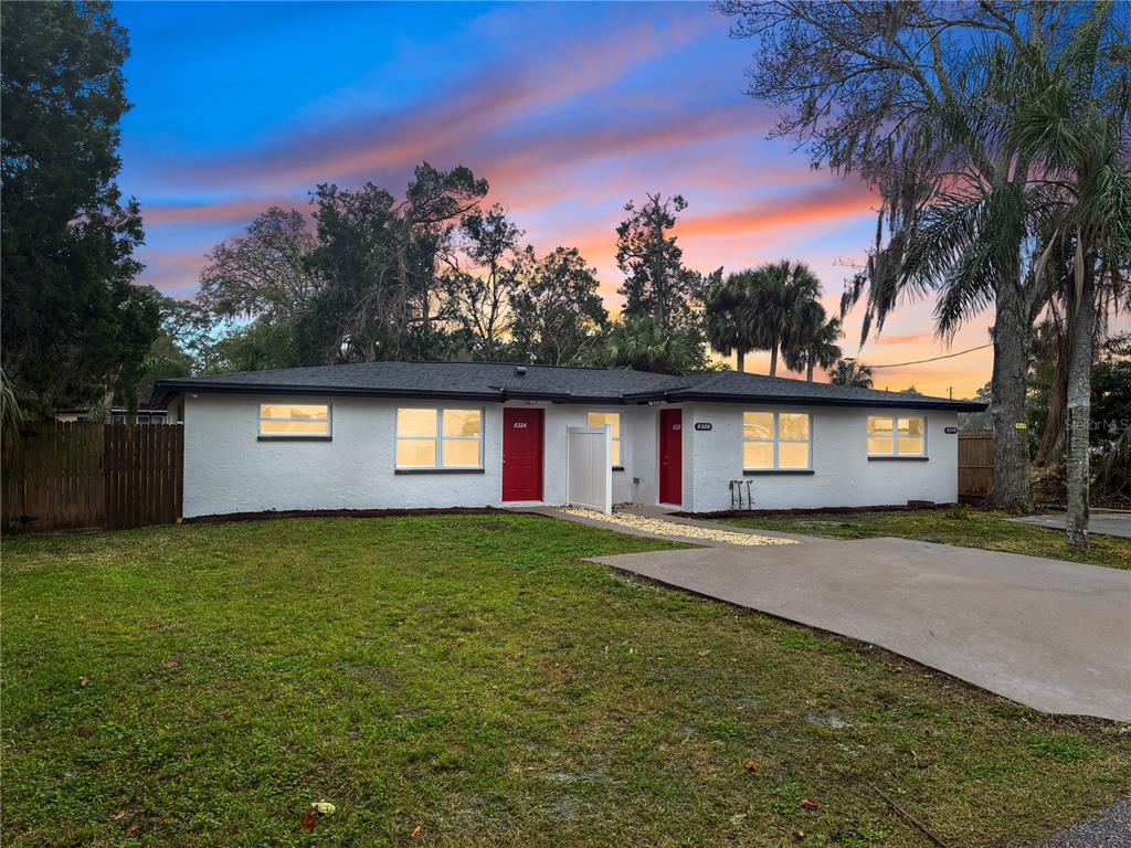 a view of a house with a yard