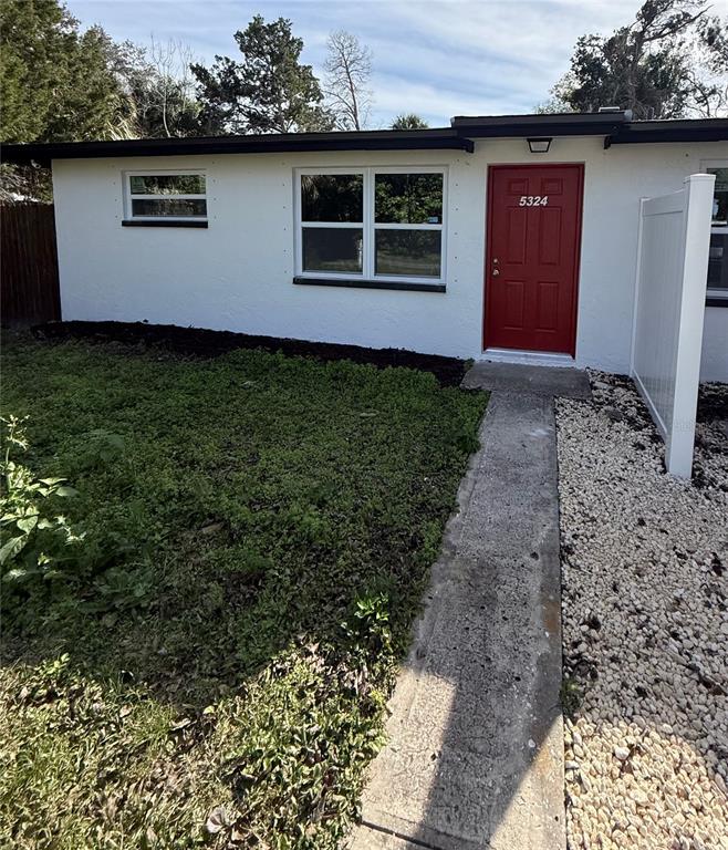 5318 Cedar Lane New Port Richey, FL 34652 - Photo 3 of 32 front view of house with a yard
