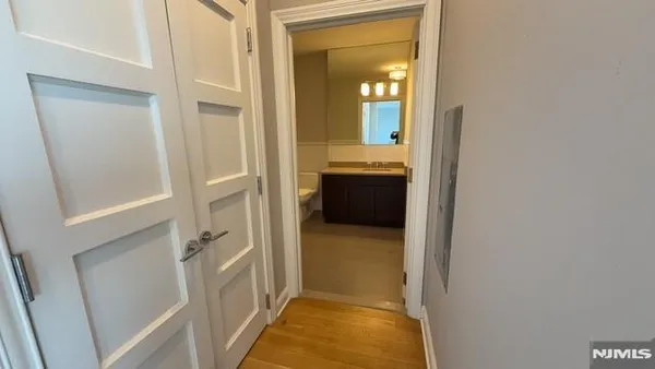 a view of a bathroom from the hallway