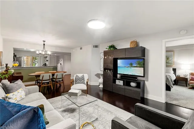 a bathroom with a granite countertop sink toilet and mirror