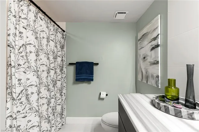 an aerial view of residential building and lake