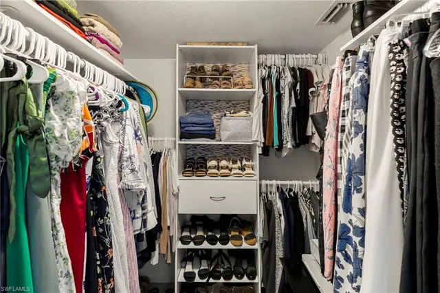 an aerial view of a houses with a lake