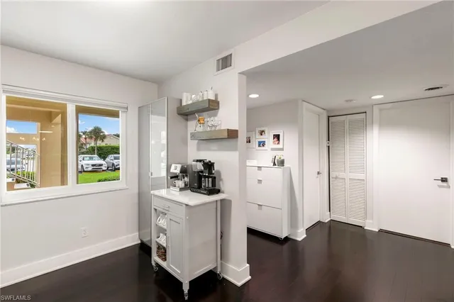 a view of a dining room furniture and window