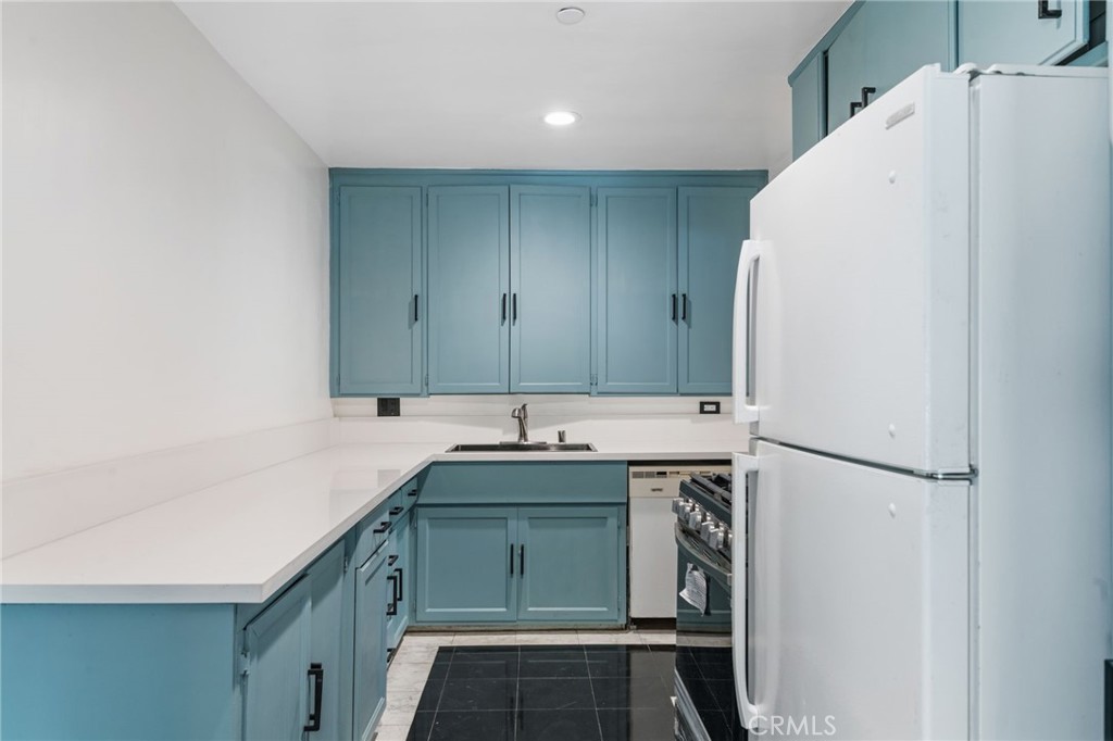 8040 Ranchito Avenue Panorama City, CA 91402 - Photo 12 of 64 a view of a kitchen with a sink and dishwasher