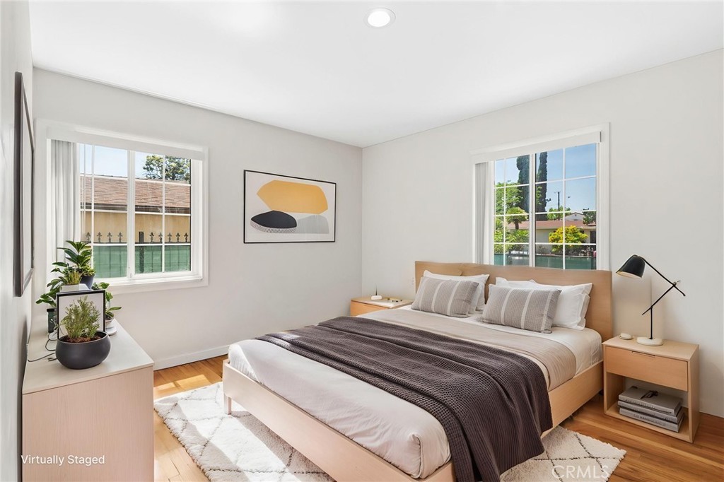 8040 Ranchito Avenue Panorama City, CA 91402 - Photo 16 of 64 a bedroom with a bed and a window