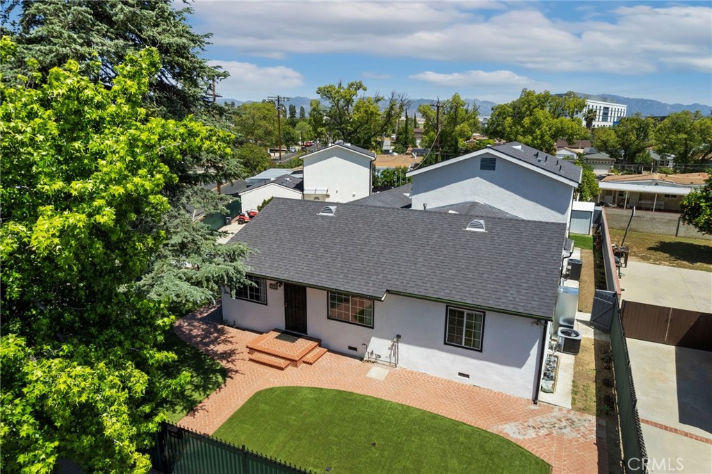 8040 Ranchito Avenue Panorama City, CA 91402 - Photo 2 of 64 aerial view of a house with yard and green space
