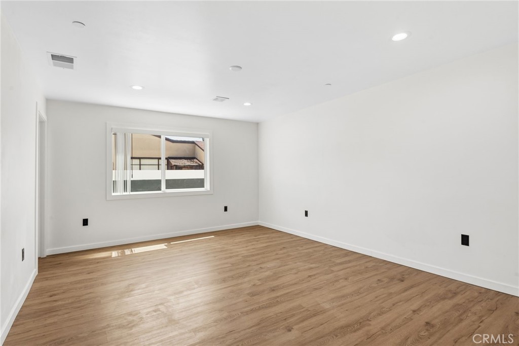 8040 Ranchito Avenue Panorama City, CA 91402 - Photo 22 of 64 wooden floor in an empty room