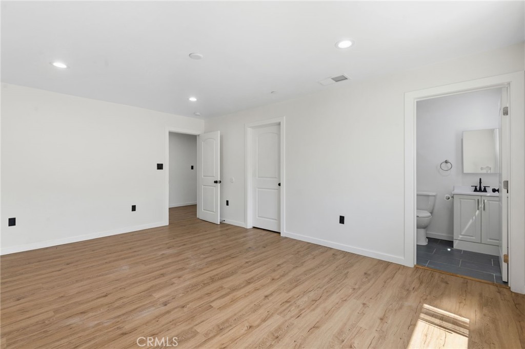 8040 Ranchito Avenue Panorama City, CA 91402 - Photo 23 of 64 a view of a room with a furniture and wooden floor