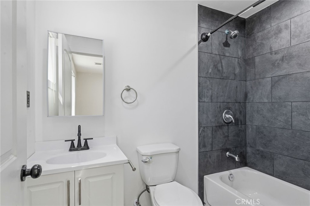 8040 Ranchito Avenue Panorama City, CA 91402 - Photo 28 of 64 a bathroom with a sink a toilet and shower