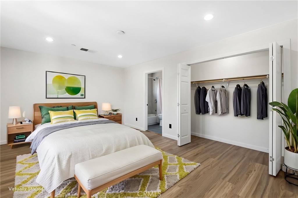 8040 Ranchito Avenue Panorama City, CA 91402 - Photo 29 of 64 a bedroom with a bed and a walk in closet