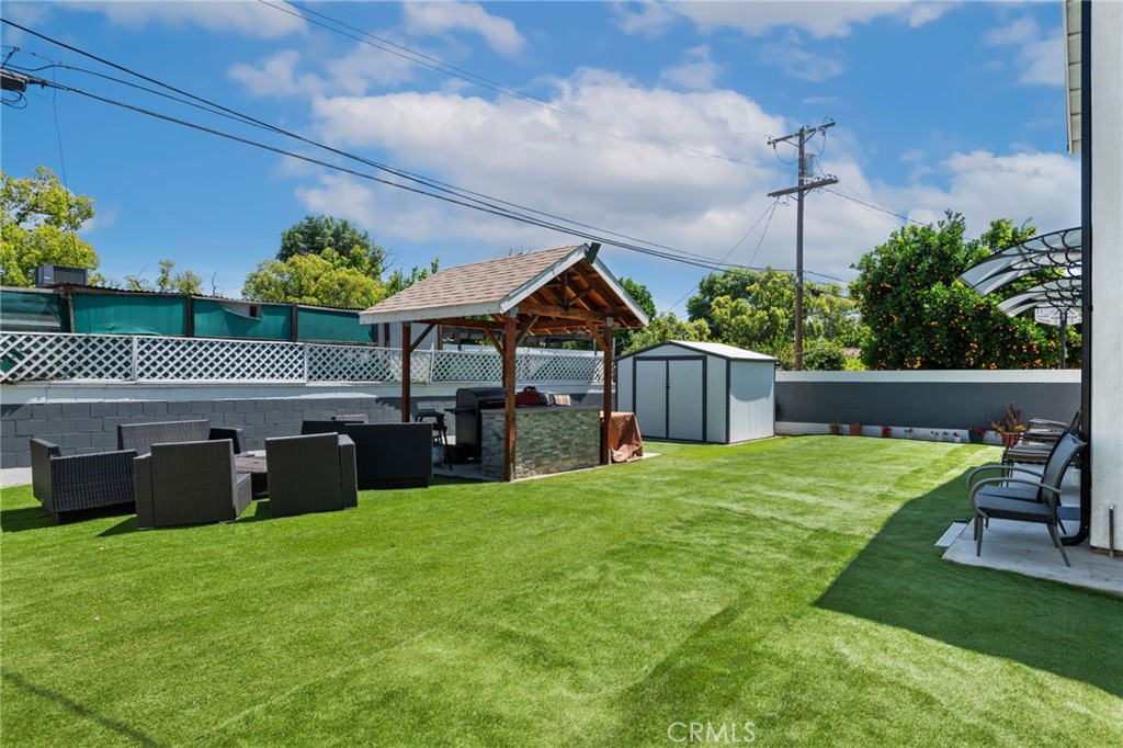 8040 Ranchito Avenue Panorama City, CA 91402 - Photo 35 of 64 a view of a house with backyard tub and sitting area