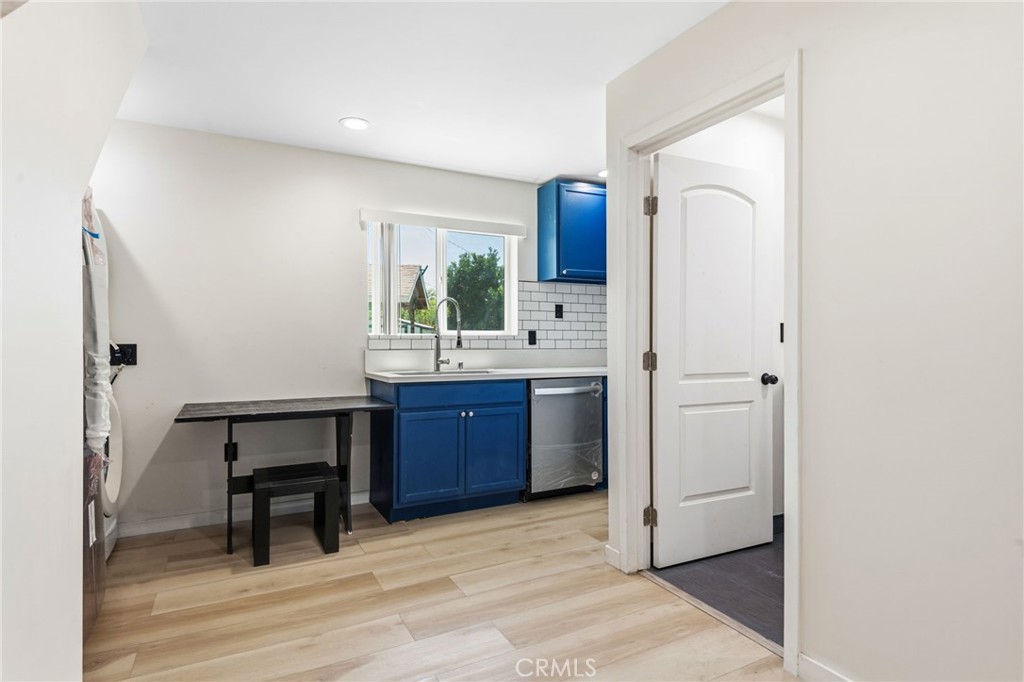 8040 Ranchito Avenue Panorama City, CA 91402 - Photo 50 of 64 a room with a refrigerator and a sink