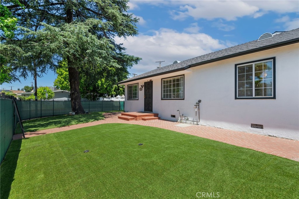 8040 Ranchito Avenue Panorama City, CA 91402 - Photo 5 of 64 a front view of house with yard and green space