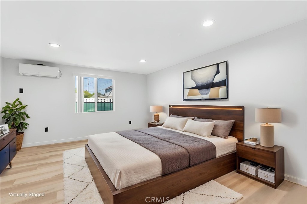 8040 Ranchito Avenue Panorama City, CA 91402 - Photo 53 of 64 a bedroom with a large bed and a potted plant
