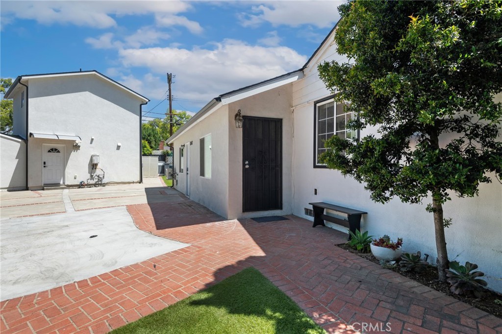 8040 Ranchito Avenue Panorama City, CA 91402 - Photo 7 of 64 a front view of a house with garden
