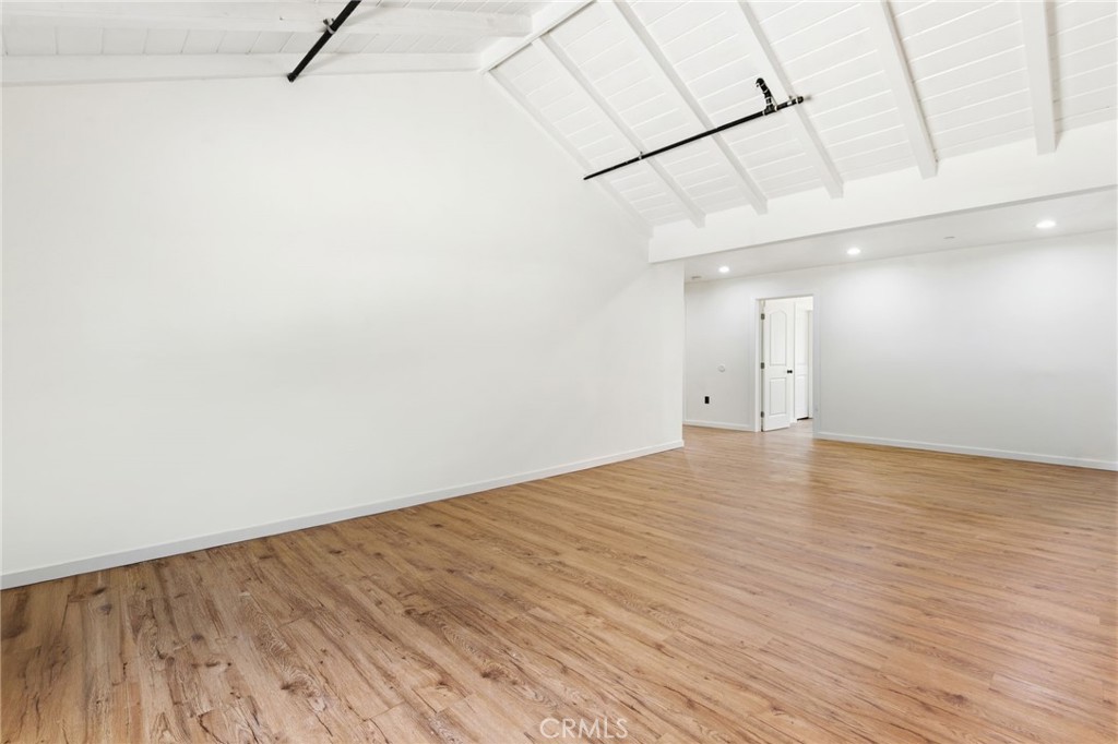 8040 Ranchito Avenue Panorama City, CA 91402 - Photo 9 of 64 a view of empty room with wooden floor