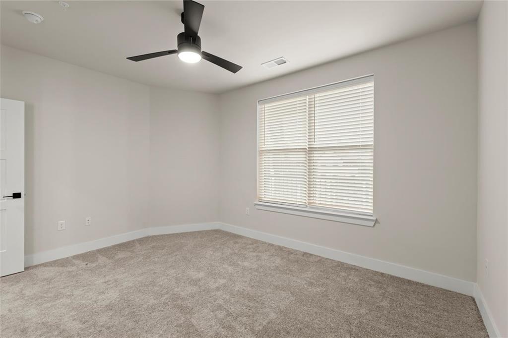 2648 Sandy Plains Road, Unit 422 Marietta, GA 30066 - Photo 18 of 37 an empty room with a window