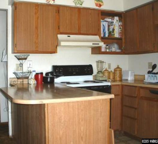 325 E Grove Reno, NV 89502 - Photo 3 of 9 a kitchen with a sink a stove and cabinets