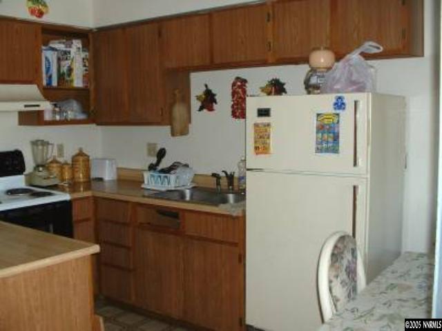 325 E Grove Reno, NV 89502 - Photo 4 of 9 a kitchen with a sink a stove top oven and cabinets