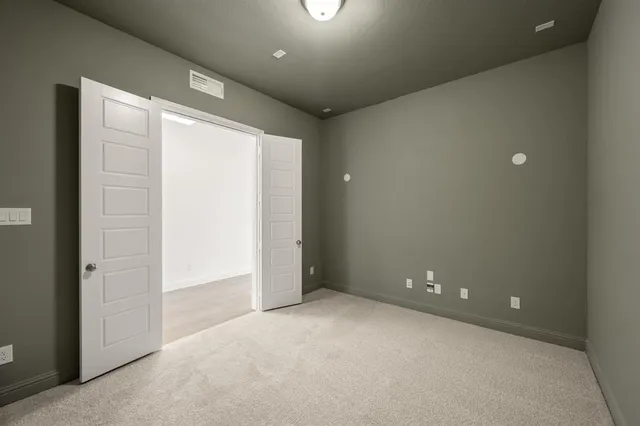 an empty room with a empty space and windows