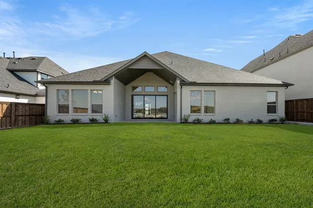 a view of a yard in front of a house