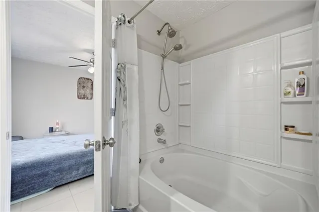 a bathroom with a bathtub and a shower