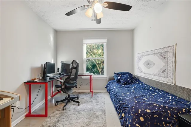 a bed room with a bed and a window