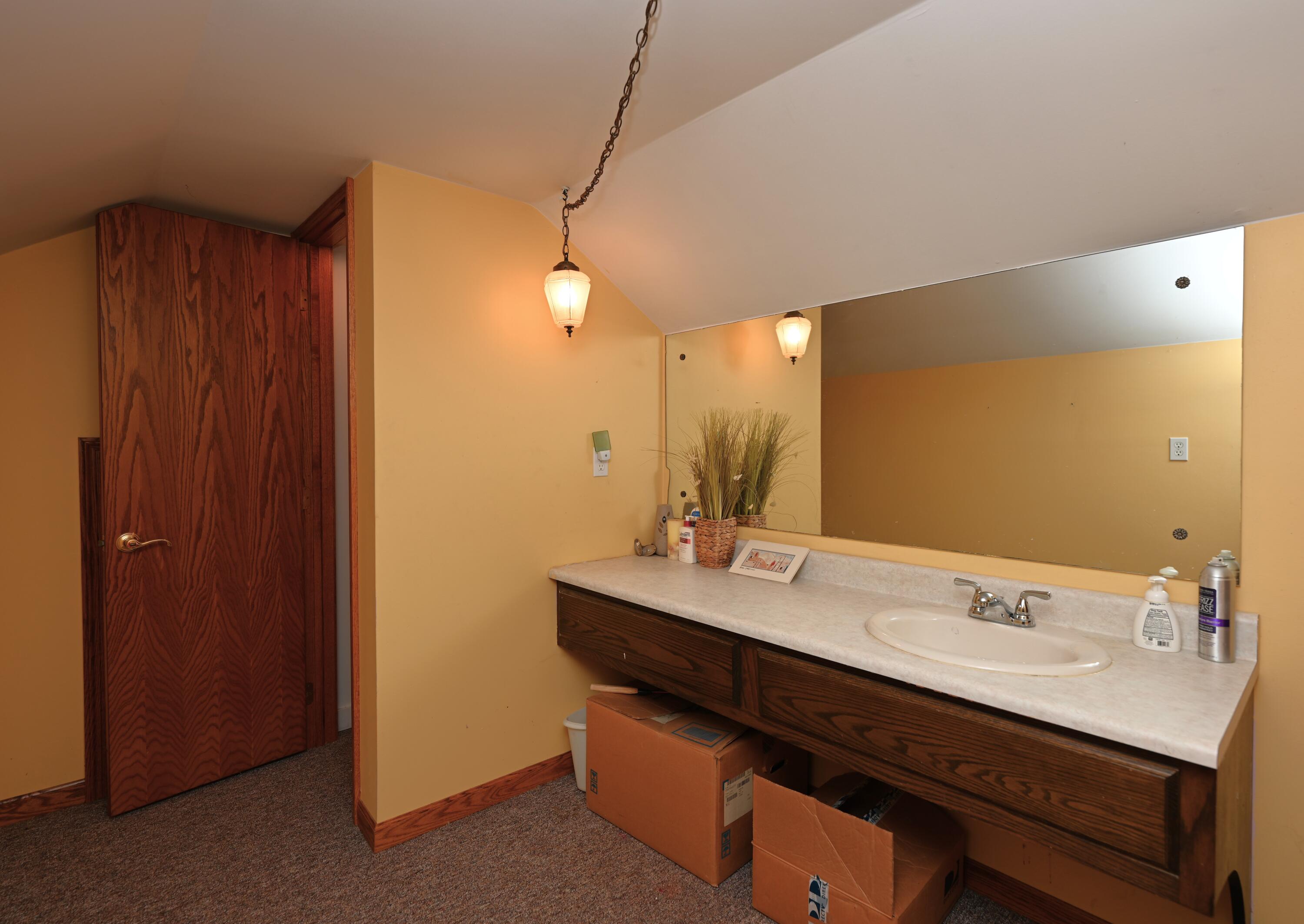 5110 West 400 North Winamac, IN 46996 - Photo 27 of 35 a bathroom with a sink double vanity and a mirror