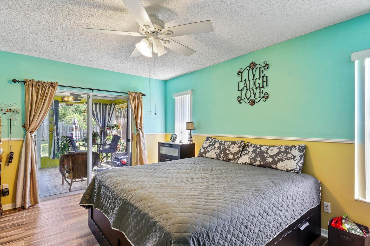 1101 Julia Heights Drive Lantana, FL 33462 - Photo 13 of 19 a bedroom with a large bed and a large window