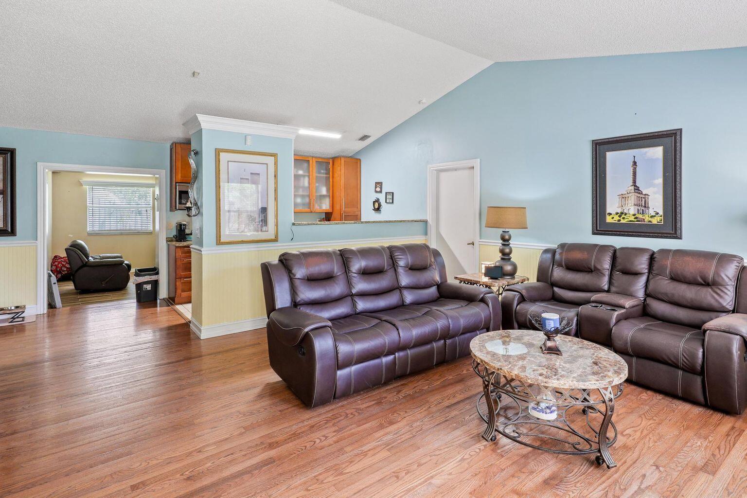 1101 Julia Heights Drive Lantana, FL 33462 - Photo 3 of 19 a living room with furniture and a wooden floor