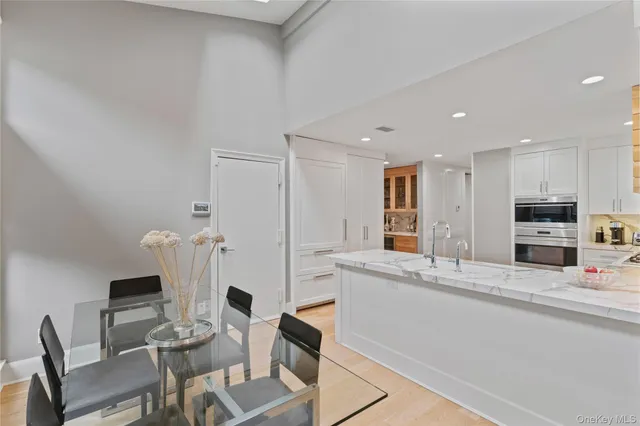 a view of kitchen with furniture and wooden floor