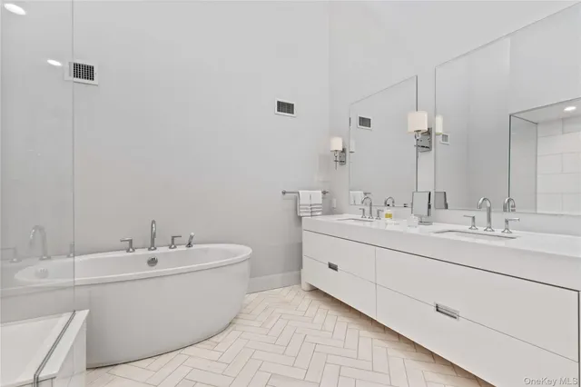 a bathroom with a double vanity sink mirror and double