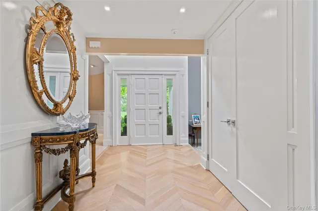 a view of a livingroom with furniture and a mirror