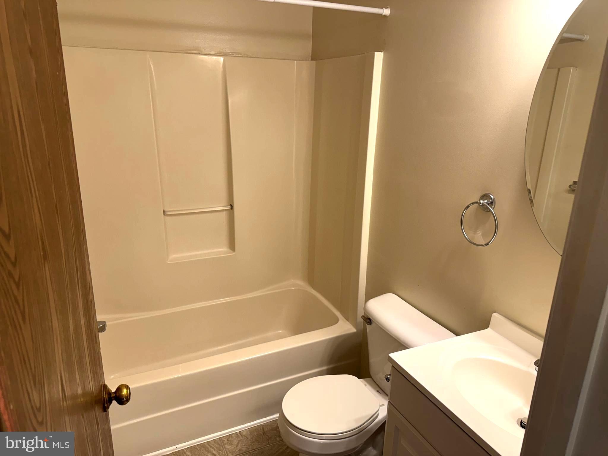 307 Willowbrook Court Winchester, VA 22602 - Photo 13 of 15 a bathroom with a toilet and a bath tub