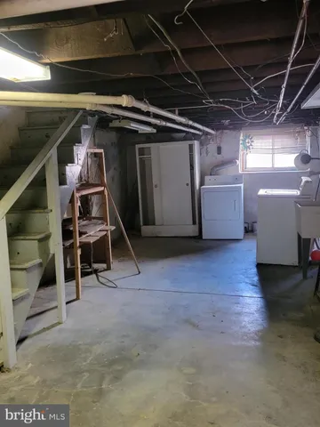 a view of a porch with a table and chairs