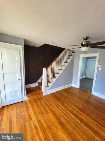 a view of a livingroom with wooden floor