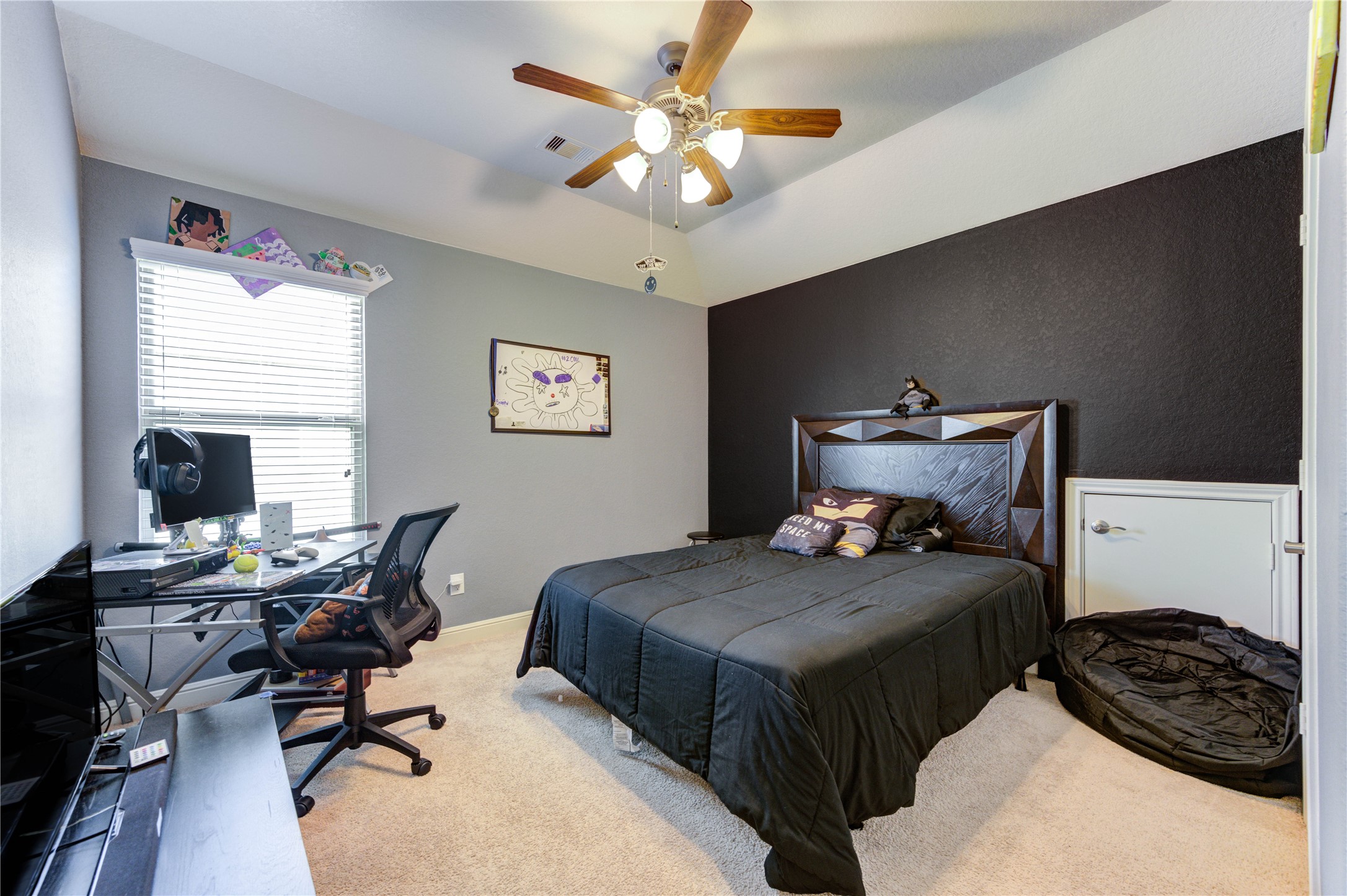 24511 Stratton Creek Drive Spring, TX 77373 - Photo 18 of 27 Spacious Secondary Bedroom – Generously sized with ample room for a queen-sized bed and additional furnishings, plus a large closet for convenient storage.