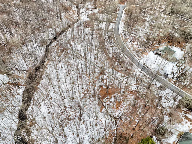 a view of an chairs and table in backyard