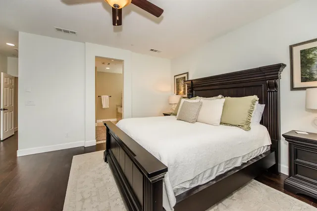 a bathroom with a sink vanity mirror and toilet