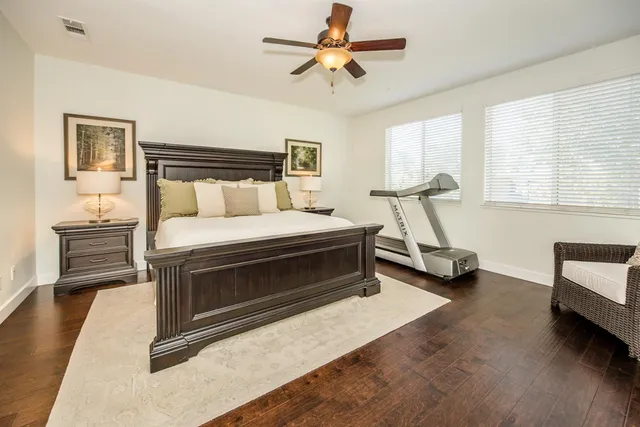 a spacious bathroom with a tub shower and sink