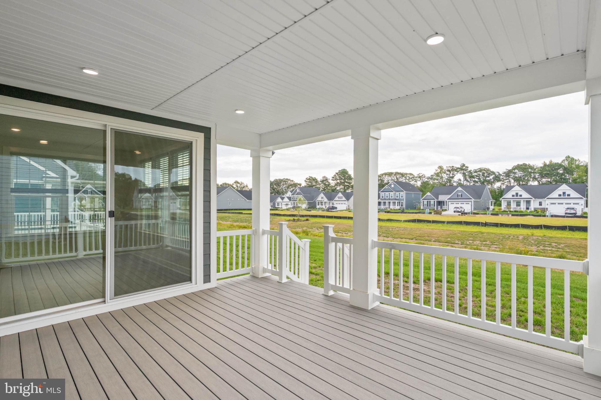 27075 Fieldfare Road Lewes, DE 19958 - Photo 19 of 56 Covered Porch Looking Over Common Area