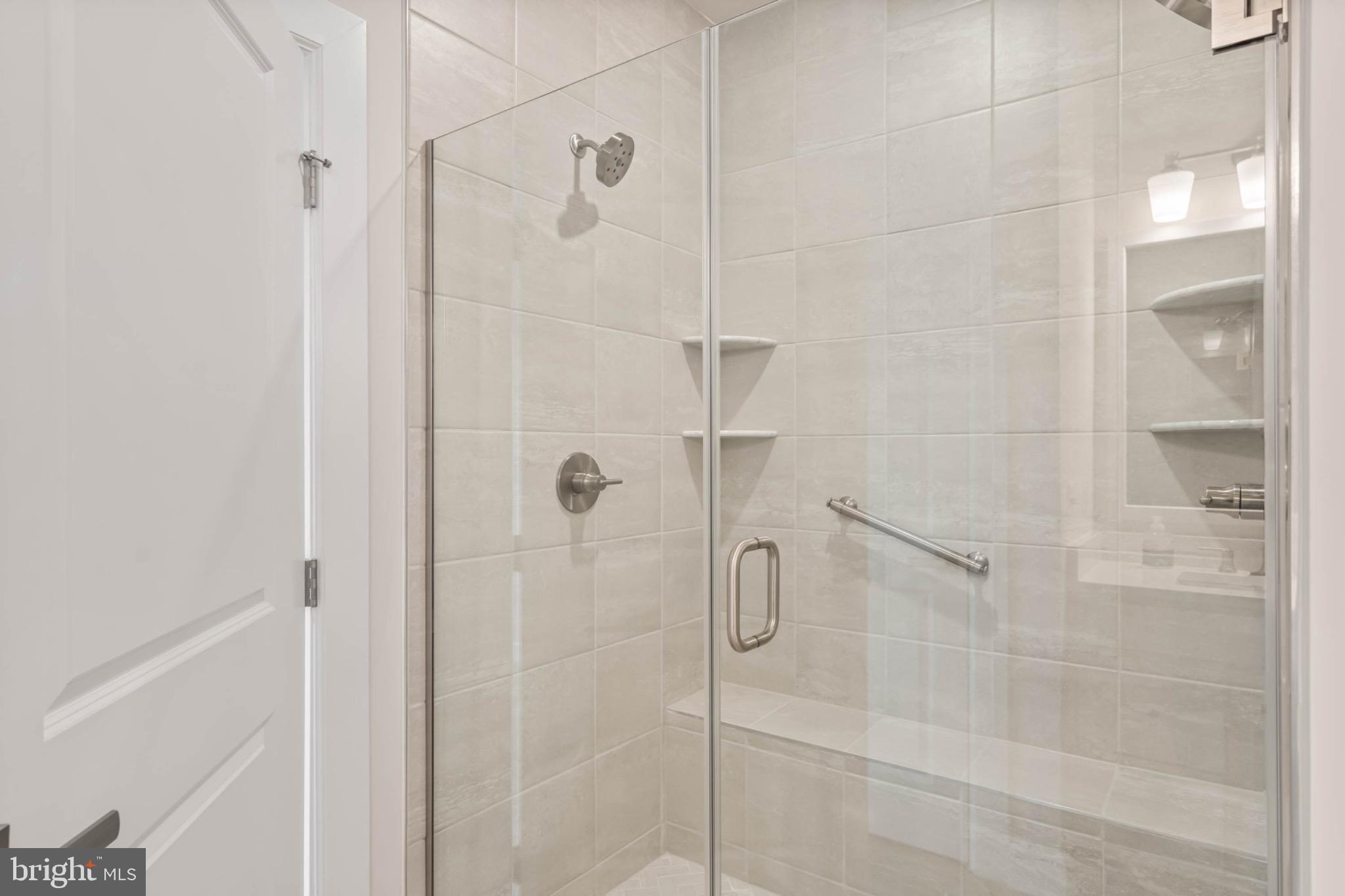 27075 Fieldfare Road Lewes, DE 19958 - Photo 23 of 56 Upgraded Shower with Added Shelving and Grab Bars