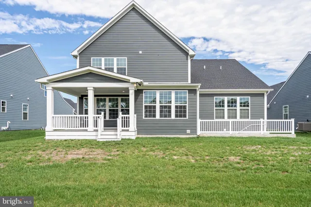 an aerial view of a house with a swimming pool