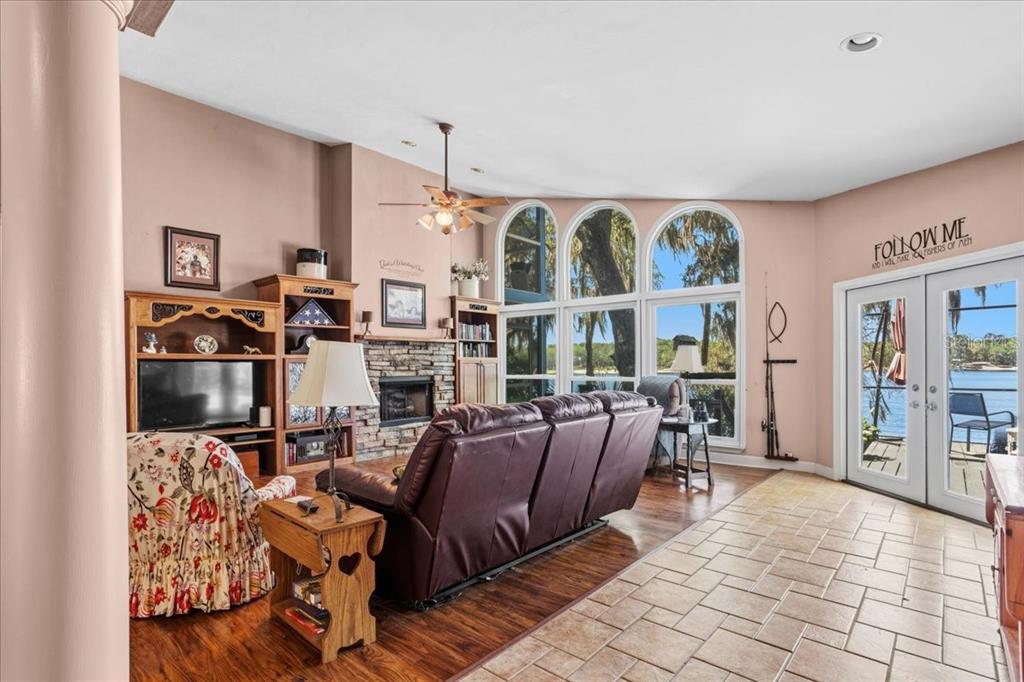 8386 Austin Road Melrose, FL 32666 - Photo 16 of 76 a living room with fireplace furniture and a window