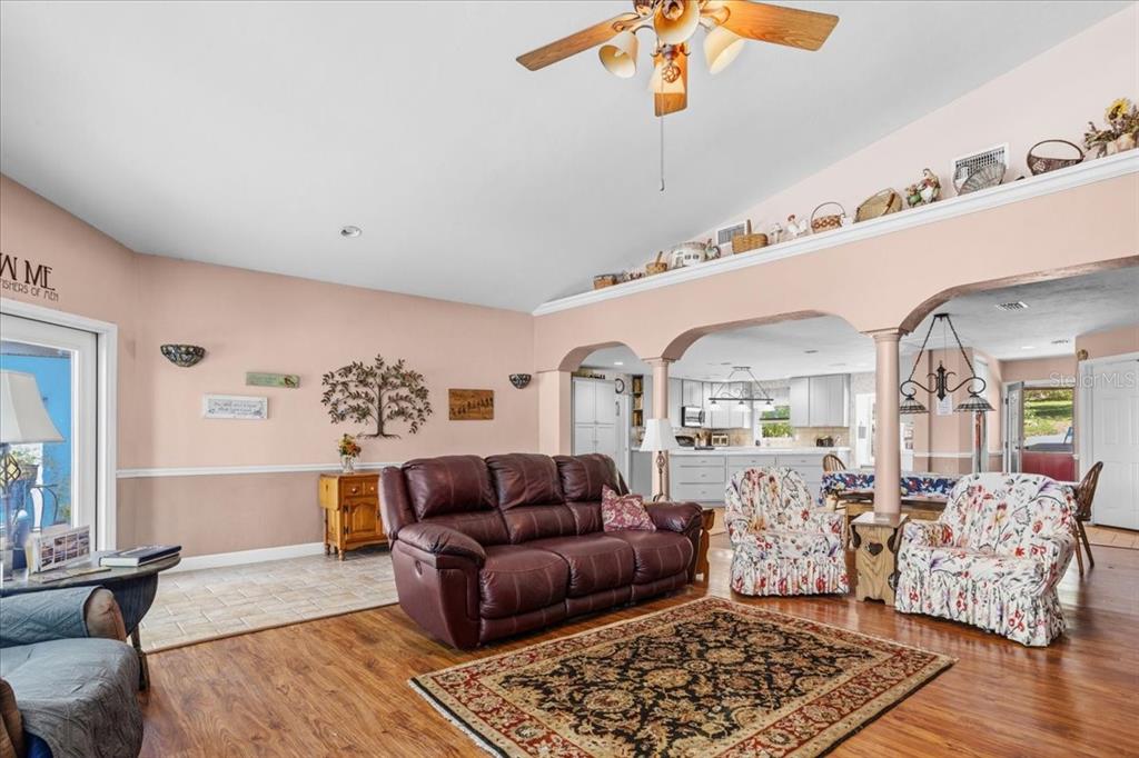 8386 Austin Road Melrose, FL 32666 - Photo 17 of 76 a living room with furniture and wooden floor