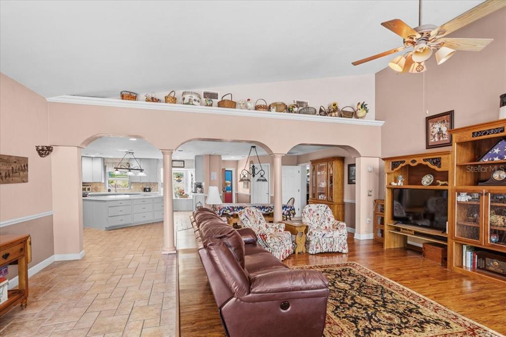 8386 Austin Road Melrose, FL 32666 - Photo 18 of 76 a living room with furniture a rug and a flat screen tv
