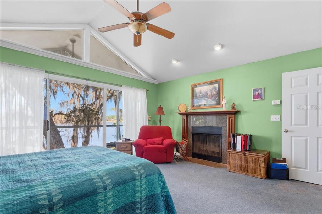 8386 Austin Road Melrose, FL 32666 - Photo 33 of 76 a bedroom with a bed and a fireplace