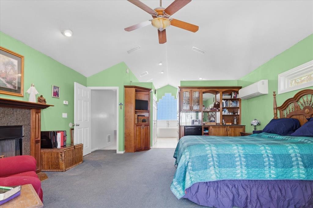 8386 Austin Road Melrose, FL 32666 - Photo 34 of 76 a bed room with a bed and a couch