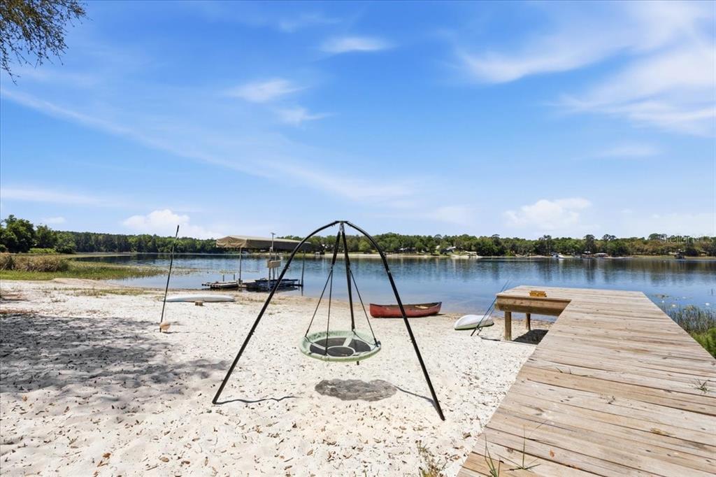 8386 Austin Road Melrose, FL 32666 - Photo 6 of 76 a view of a lake with chairs